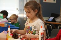 Kindergartners working on a Thanksgiving project