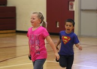 Kindergartners in phys ed classes doing a healthy plates activity
